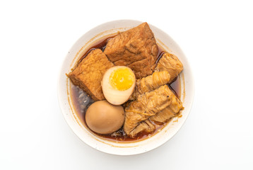 hard-boiled egg in brown sauce or sweet gravy isolated on white background