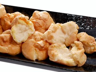 Cream Puff  is on a plate on a white background.