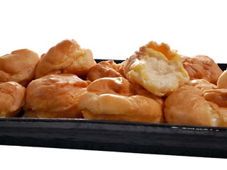 Cream Puff  is on a plate on a white background.