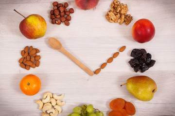 Clock made of nutritious food containing natural minerals, vitamins and dietary fiber, time for healthy nutrition concept
