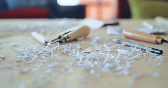 Close-up of shavings, pencils and sharp instruments, gravers for linocut