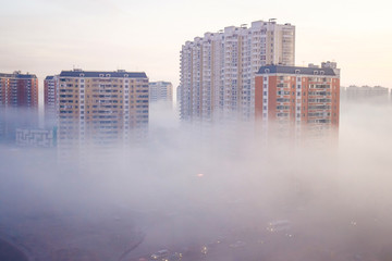 Fototapeta premium Morning fog in the city. Dormitory area