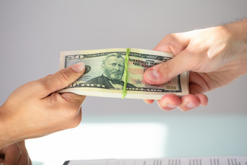 Businessperson Taking Bribe From Partner