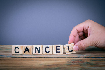 cancel, wooden letters on the office desk, informative and communication background