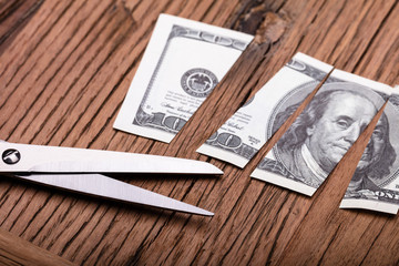 Cutted Dollar Banknote And Scissor