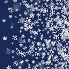 Christmas snow background with scattered snowflakes falling in winter