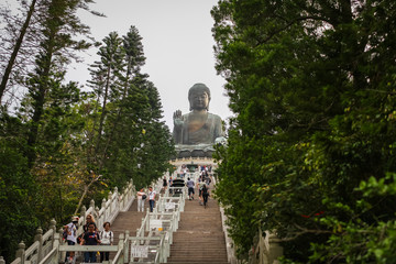 Lantau Island, Hong Kong april 2018: Tourists walk up 268 steps to see Tian Tan Buddha, also known as the Big Buddha