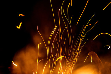 Night bonfire background with smoke and sparks