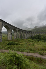 Fototapeta na wymiar Glenfinnan Viaduct is a railway bridge on the West Highland Line near the top of Loch Shiel in the West Highlands of Scotland