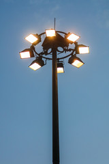 Lanterns on a pole against the sunset