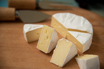 slices of cheese camembert on a cutting board