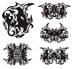 Abstract horned dragon head and butterflies formed from it. Scary ethnic dragon head in the form of a butterfly wing and the wings of butterflies created from her. Black on white