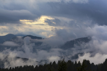 Dramatic clouds at sunset and beautiful light in the Dolomite Alps