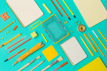 school supplies at colorful paper background