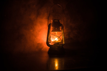 Oil Lamp Lighting up the Darkness or Burning kerosene lamp background, concept lighting. Selective focus