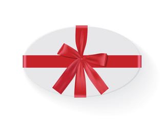 oval white box with a red bow