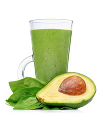 Green smoothies in a glass with avocado