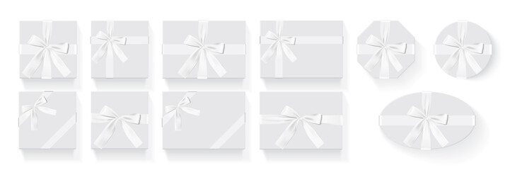 different shapes of boxes with a white bow