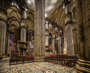 Columns, ceiling, vaults, stainglass windows, alters of interior of the Duomo di Milano