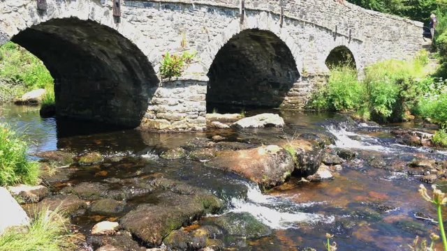 Tilt up of road bridge and East Dart River near Postbridge in Dartmoo