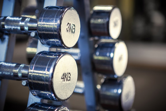 Close up of old chrome dumbbell set.