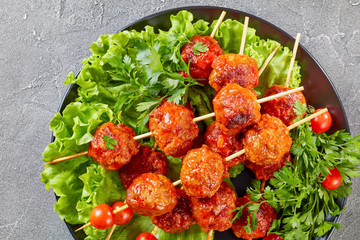 meatballs on skewers with fresh tomatoes