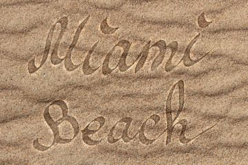 Logo with letters of Miami Florida on see   sand