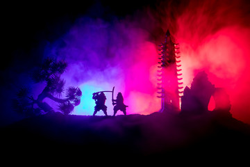 Samurai fighting concept. Silhouette of samurais in duel near tree and old temple. Picture with two...