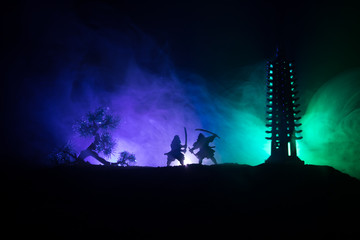Samurai fighting concept. Silhouette of samurais in duel near tree and old temple. Picture with two...