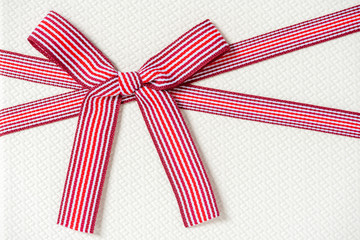 giftbox with red striped bow for christmas, birthday party , top view