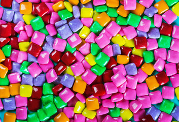 many different colors chewing gum background. Chewing gum in the form of a square