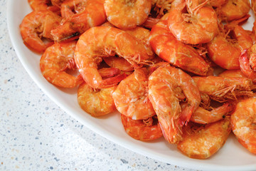 Cooked Fresh Shrimps on a White Plate Over Stone Table. Fresh and Healthy Seafood