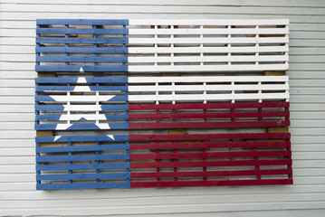 Texas Lone Star flag painted on industrial wooden palatte.