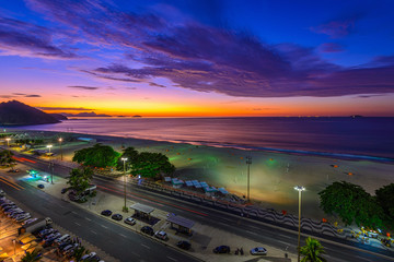 Sunrise view of Copacabana beach and Avenida Atlantica in Rio de Janeiro, Brazil