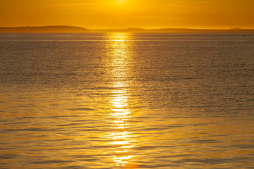 Sunset over the sea, bright, orange, natural background