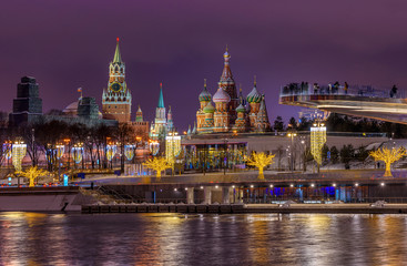 Obraz premium Spasskaya Tower, Moscow Kremlin and Saint Basil s Cathedral in Moscow, Russia. Architecture and landmarks of Moscow. Moscow with Christmas decoration.