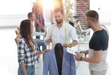 young designers discussing male costume