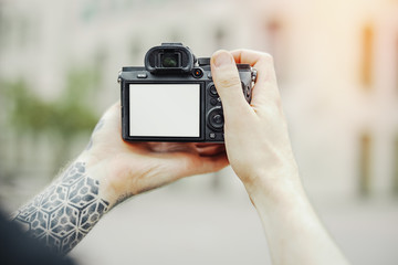 Close up of man hands holding camera