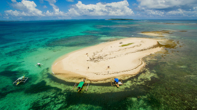 little naked island pacific ocean dako siargao phillipines canoes ocean