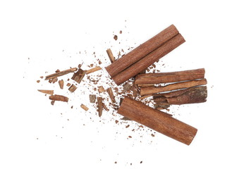 Cinnamon sticks with shavings isolated on white background, top view