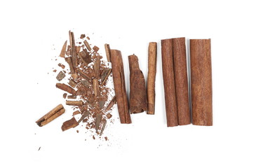 Cinnamon sticks with shavings isolated on white background, top view