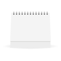 Mock up white paper calendar stands on a table
