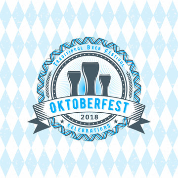 Beer festival Oktoberfest celebrations. Vintage beer badge on the traditional Bavarian linen flag background