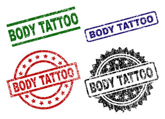 BODY TATTOO seal prints with damaged surface. Black, green,red,blue vector rubber prints of BODY TATTOO title with grunge surface. Rubber seals with round, rectangle, medallion shapes.