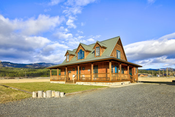 Nice wooden ranch home with beautiful landscape in the countryside.