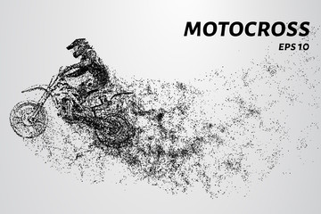 Motocross particles. A motorcyclist performs stunts