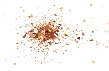 Crushed red cayenne pepper, dried chili flakes and seeds pile isolated on white background, top view