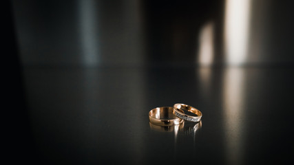 wedding rings on a steel dark background