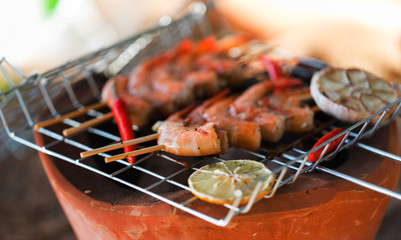 Fresh shrimps on barbecue outdoors