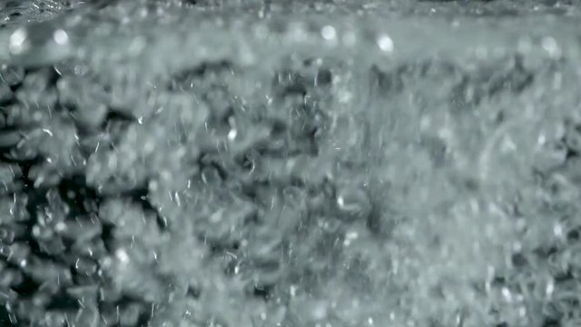 Bubbles rising to the surface on black backgrounds